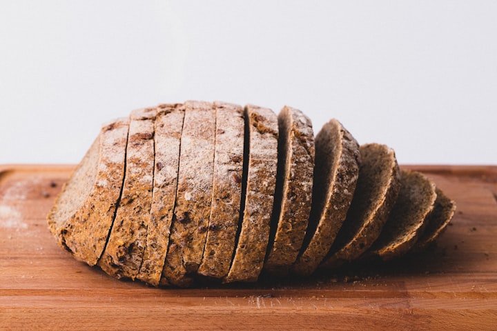 Crusty artisan bread loaves cooling on a table