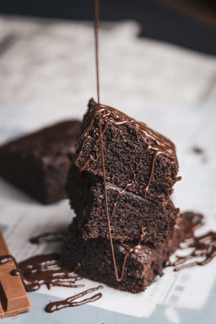 Chocolate cake slice with glossy frosting